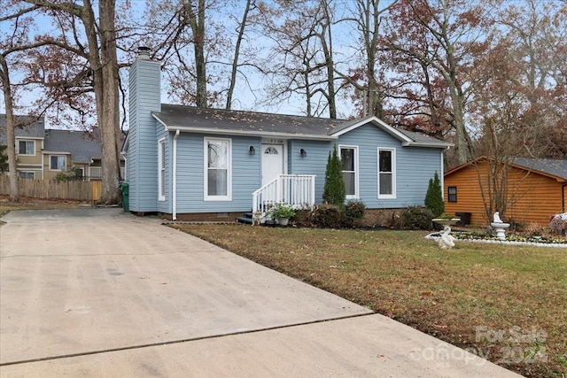 ranch-style house with a front lawn