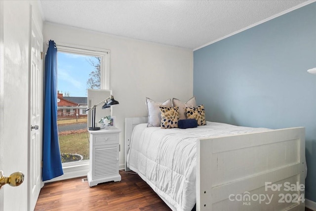 1928 Boulding Ave, High Point, NC 27265 - bedroom with ornamental molding, a textured ceiling, and wood finished floors
