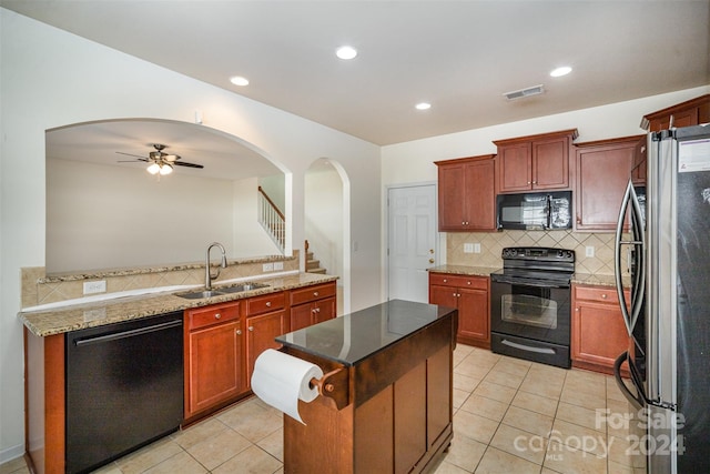 kitchen with black appliances, sink, ceiling fan, decorative backsplash, and light tile patterned floors