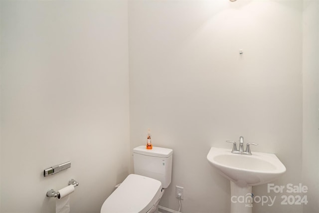 bathroom featuring toilet