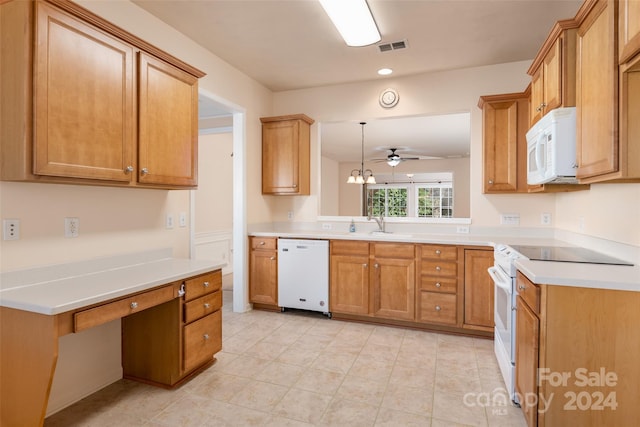 kitchen featuring ceiling fan, white appliances, sink, and decorative light fixtures