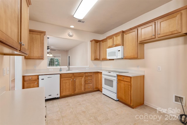 kitchen featuring ceiling fan, white appliances, and sink