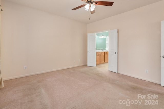 empty room with light carpet and ceiling fan