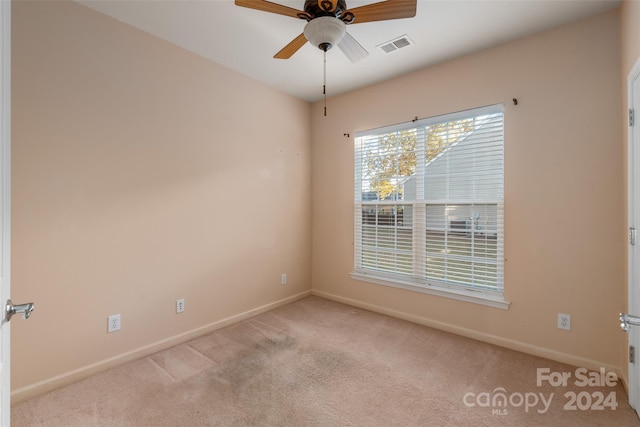 carpeted empty room with ceiling fan