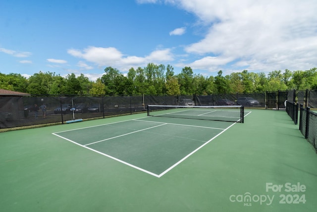 view of sport court featuring basketball hoop