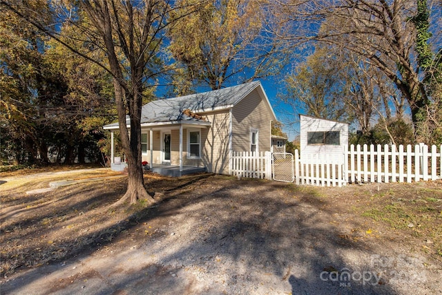 view of side of home with a porch