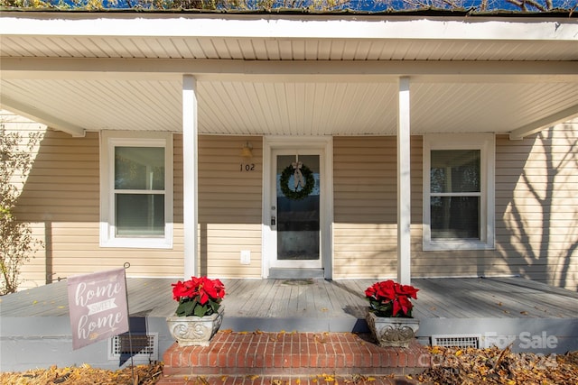 doorway to property with a porch