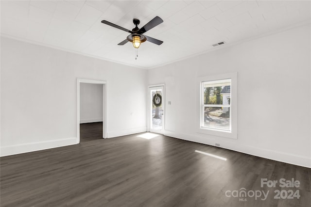 unfurnished room with dark hardwood / wood-style floors, ceiling fan, and crown molding