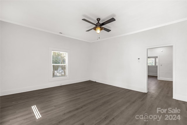 spare room featuring crown molding, dark hardwood / wood-style flooring, and ceiling fan