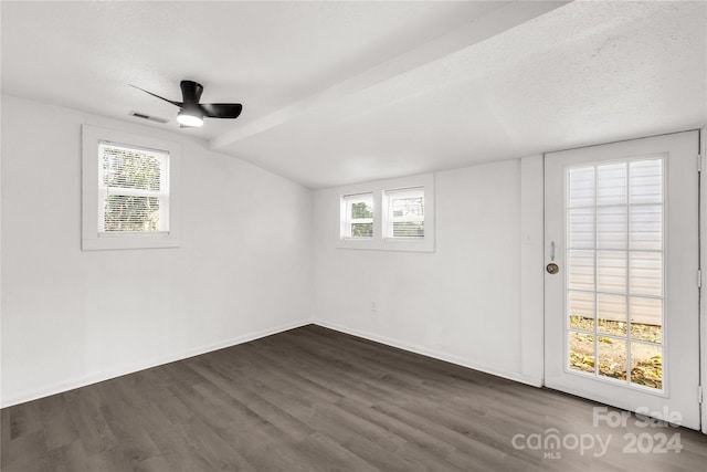 spare room with ceiling fan, dark hardwood / wood-style flooring, and a wealth of natural light