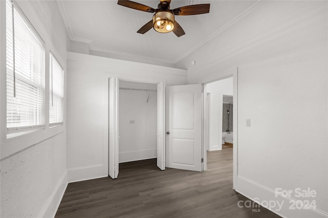 unfurnished bedroom with dark hardwood / wood-style floors, ceiling fan, and crown molding