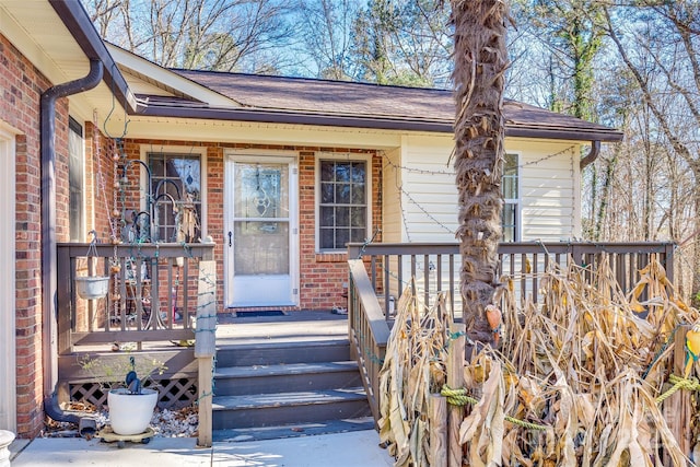 doorway to property with a wooden deck