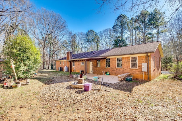 back of house with a patio