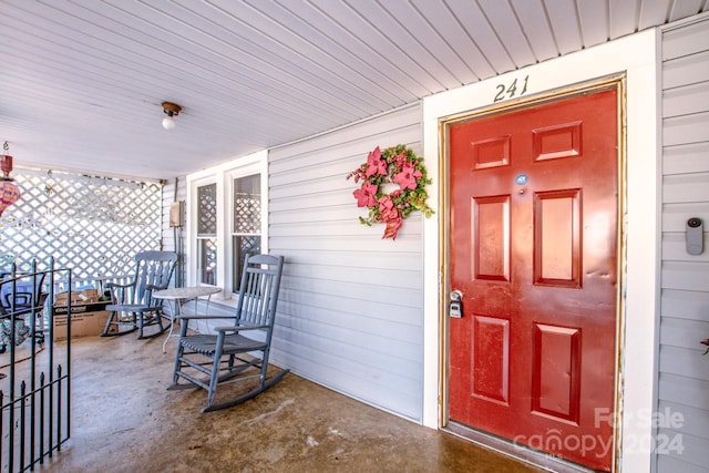 doorway to property featuring a porch