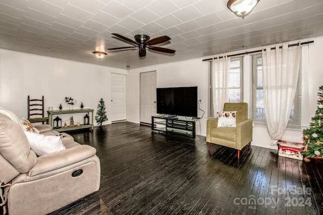 living room featuring hardwood / wood-style floors and ceiling fan