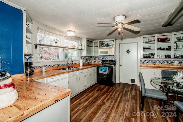 kitchen featuring tasteful backsplash, white appliances, sink, white cabinets, and butcher block counters