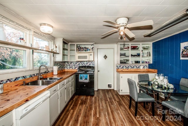 kitchen featuring white appliances, sink, dark hardwood / wood-style floors, butcher block countertops, and white cabinetry