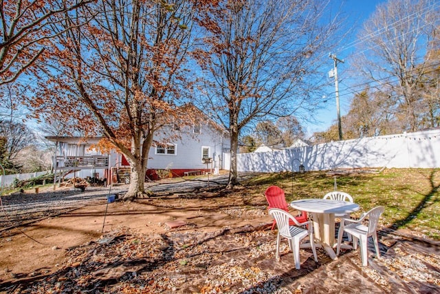 view of yard featuring a wooden deck