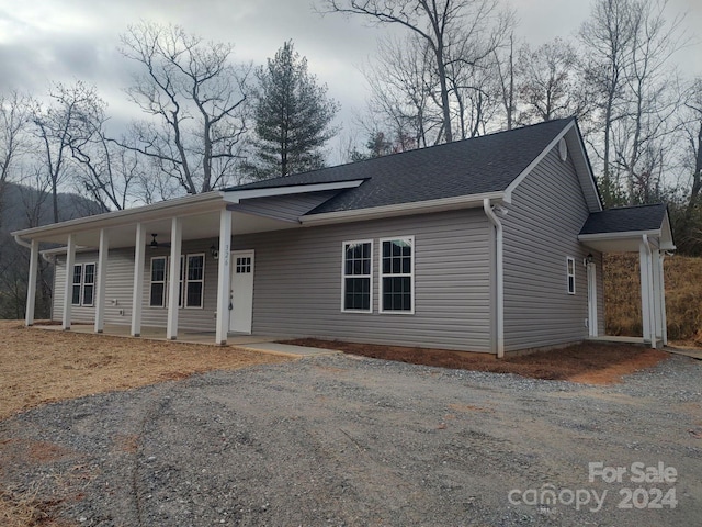 ranch-style house featuring covered porch