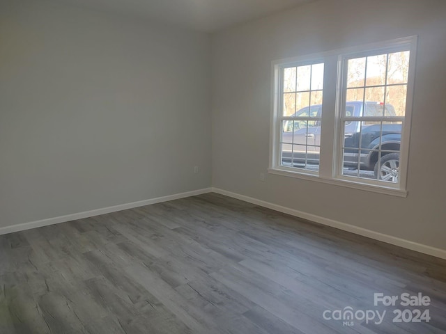 unfurnished room featuring wood-type flooring