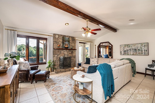 living room featuring vaulted ceiling with beams, light tile patterned flooring, a fireplace, and ceiling fan