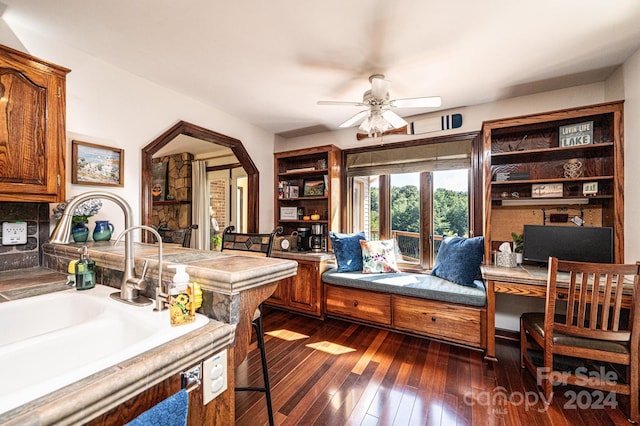 interior space featuring ceiling fan, dark wood-type flooring, and sink