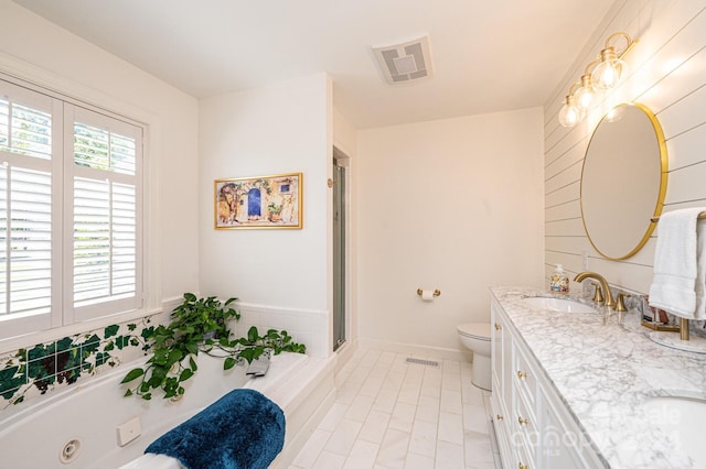 full bathroom with tile patterned floors, vanity, toilet, and shower with separate bathtub