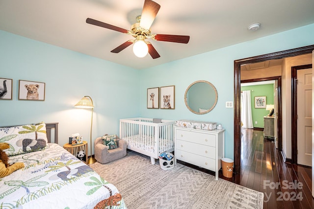 bedroom featuring ceiling fan and wood-type flooring