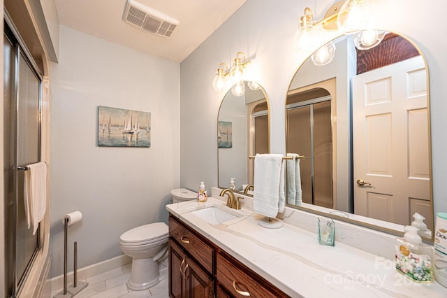 bathroom with tile patterned flooring, vanity, and toilet