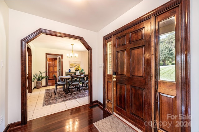 entryway featuring a notable chandelier and light hardwood / wood-style flooring