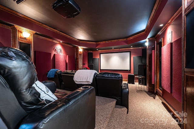 carpeted cinema featuring ornamental molding