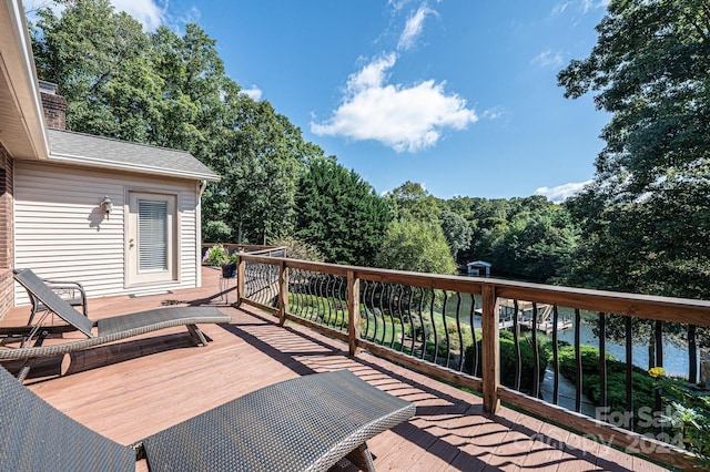 wooden deck with a water view