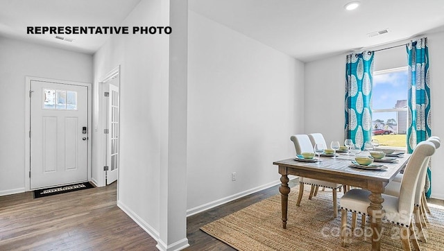 dining space featuring dark hardwood / wood-style flooring