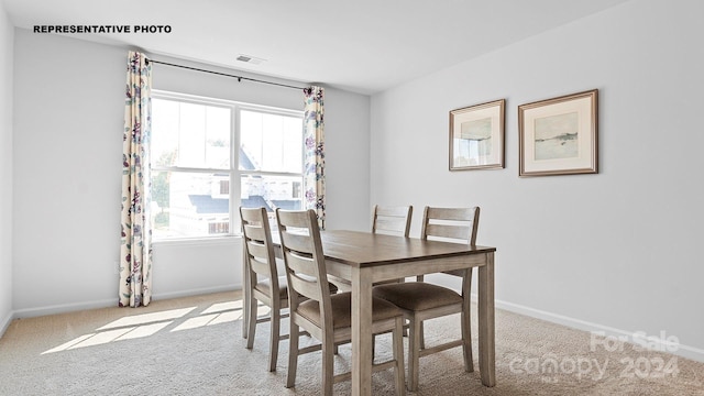 dining area with light carpet