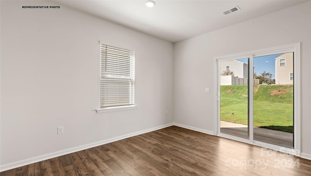 empty room featuring dark hardwood / wood-style floors