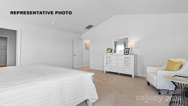 carpeted bedroom featuring lofted ceiling