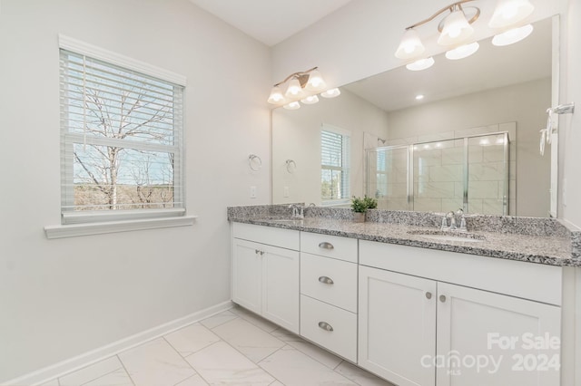 bathroom with vanity and an enclosed shower