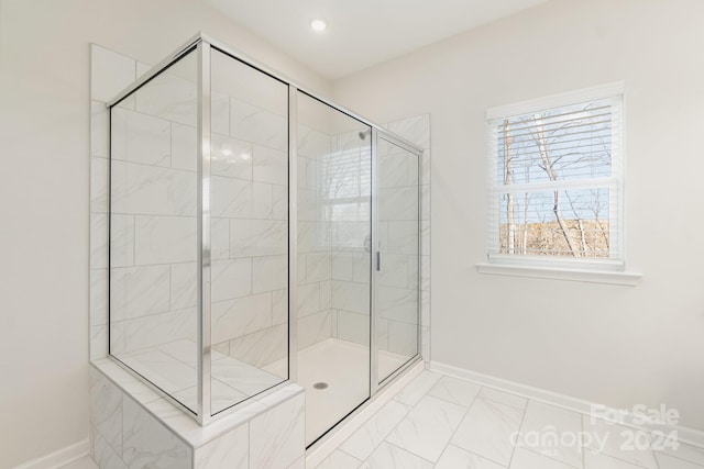 bathroom featuring an enclosed shower