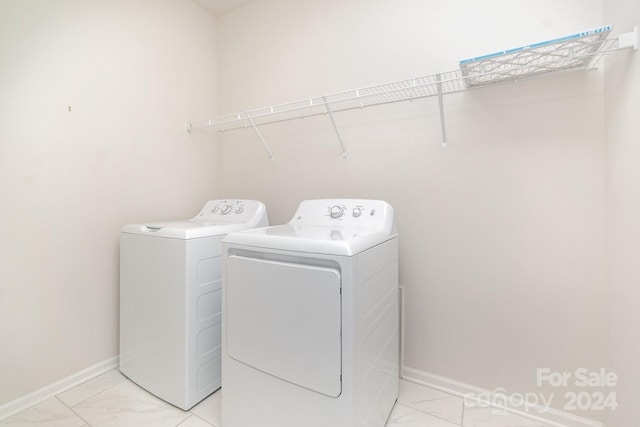 laundry room featuring separate washer and dryer