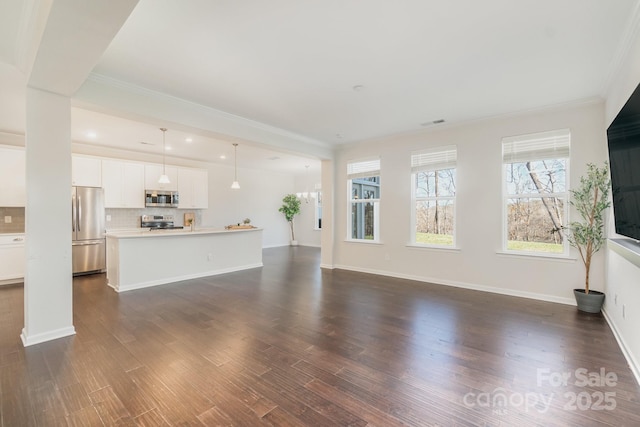 unfurnished living room featuring dark wood-type flooring and ornamental molding