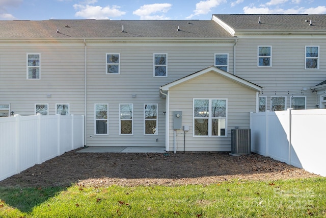 rear view of house with cooling unit