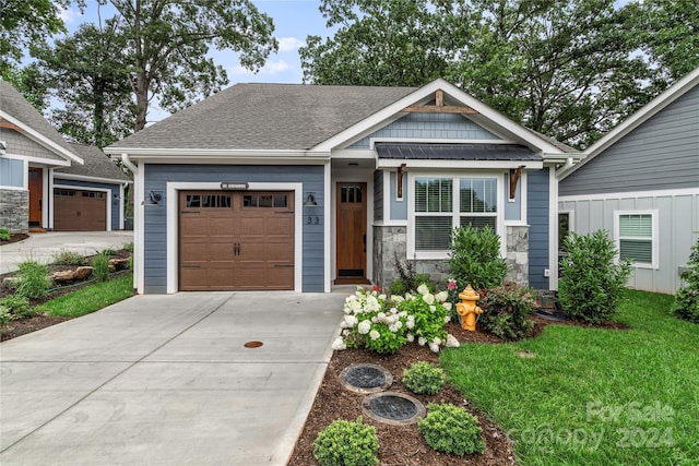 20 Heartleaf Cir Lot 7, Arden, NC 28704 - craftsman house with a garage, driveway, roof with shingles, a front yard, and stone siding