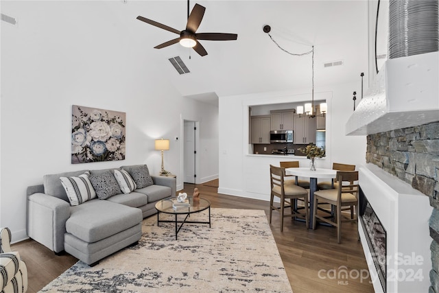 20 Heartleaf Cir Lot 7, Arden, NC 28704 - living room featuring a ceiling fan, wood finished floors, a chandelier, high vaulted ceiling, and a fireplace
