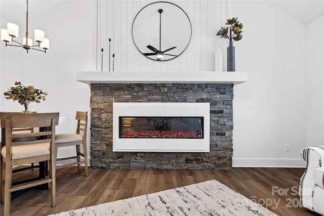 20 Heartleaf Cir Lot 7, Arden, NC 28704 - detailed view of wood finished floors, a chandelier, a stone fireplace, and a ceiling fan