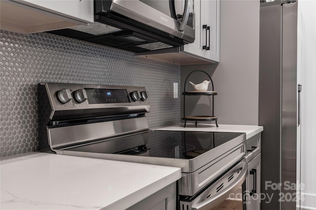 20 Heartleaf Cir Lot 7, Arden, NC 28704 - kitchen with stainless steel appliances and wallpapered walls