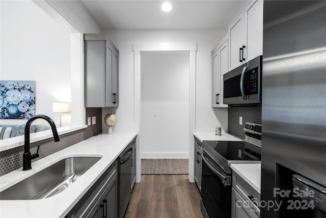 20 Heartleaf Cir Lot 7, Arden, NC 28704 - kitchen featuring appliances with stainless steel finishes, backsplash, light countertops, dark wood-type flooring, and recessed lighting