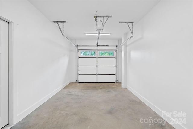 20 Heartleaf Cir Lot 7, Arden, NC 28704 - garage with baseboards and a garage door opener