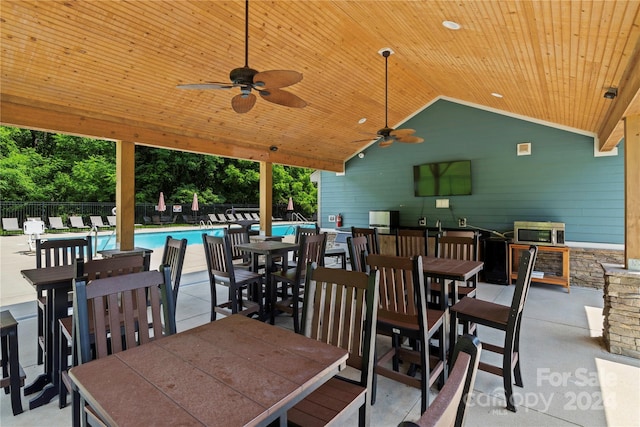 20 Heartleaf Cir Lot 7, Arden, NC 28704 - view of patio featuring outdoor dining space, a ceiling fan, and a community pool