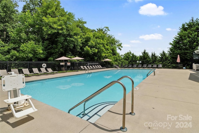 20 Heartleaf Cir Lot 7, Arden, NC 28704 - community pool featuring a patio and view of scattered trees