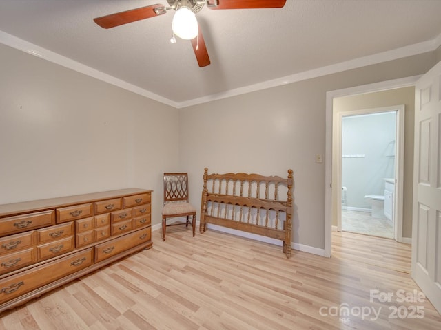 bedroom with light hardwood / wood-style floors, ensuite bath, and crown molding